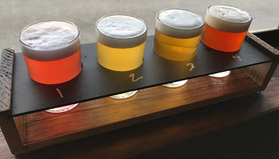 A flight of La Cabra beer